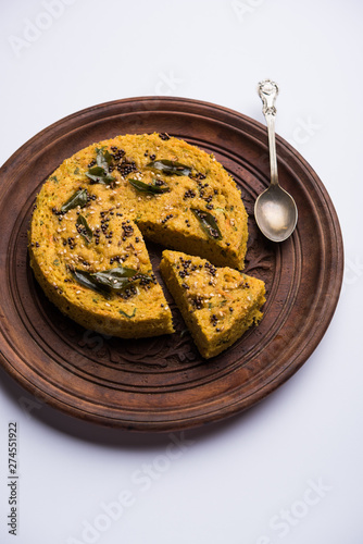 Handvo/handwa is a vegetable cake originating from the Gujarat, India. selective focus photo