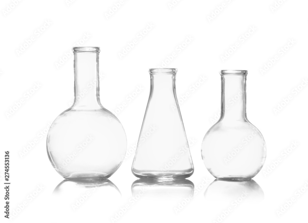 Group of empty chemistry glassware isolated on white Group of empty chemistry glassware isolated on white