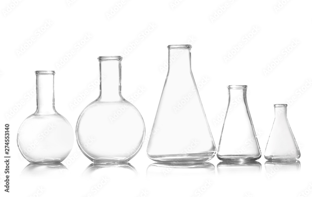 Group of empty chemistry glassware isolated on white Group of empty chemistry glassware isolated on white