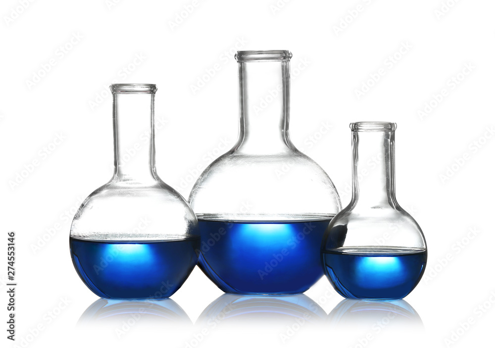 Florence flasks with liquid samples on white background. Chemistry glassware