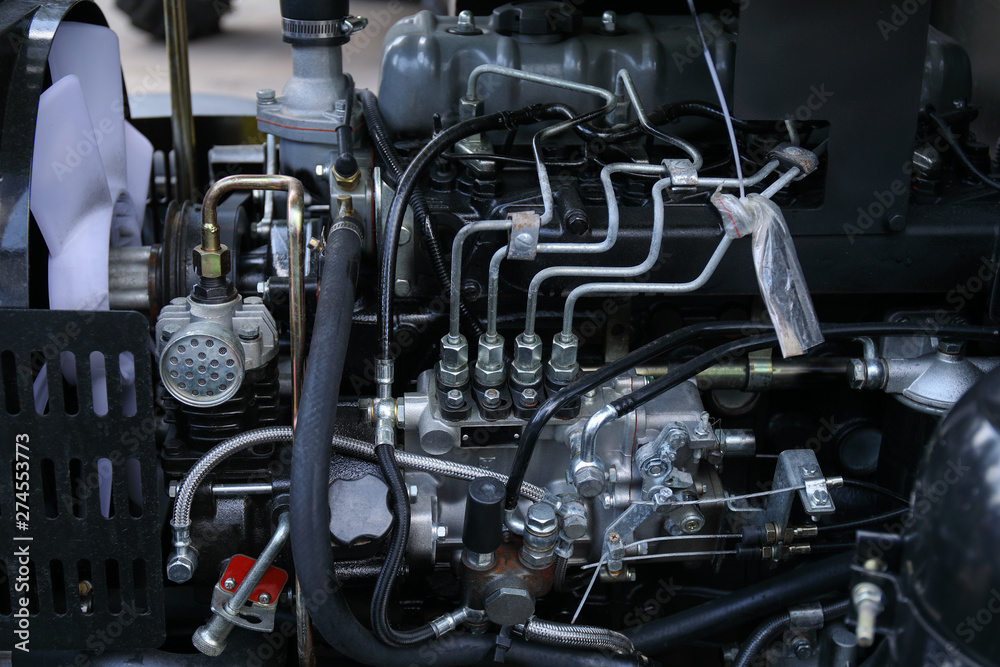 Obraz premium Element of engine system of new modern agricultural tractor or combine or harvester