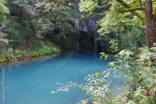 Amazingly beautiful mountain s spring with heavenly blue water color and small waterfall named Krupajsko Vrelo  spring of Krupaj   near Krupaja village  Eastern Serbia 