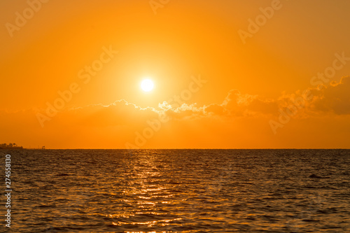 Colorful dawn over the sea  Sunset. Beautiful magic sunset over the sea. Beautiful sunset over the ocean. Sunset over water surface.