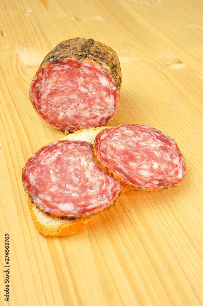 typical traditional Italian salami with bread and suppressed for a snack with healthy food typical traditional Italian salami with bread and suppressed for a snack with healthy food