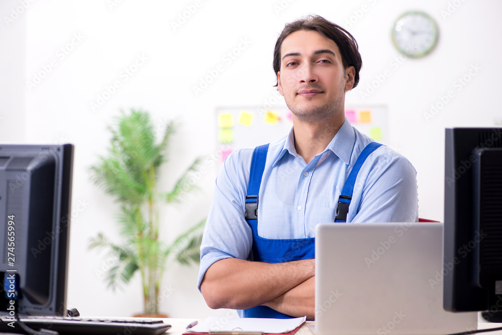 Male it specialist working in the office Male it specialist working in the office
