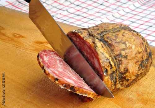typical traditional Italian salami with bread and suppressed for a snack with healthy food