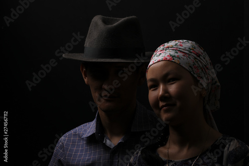 studio portrait of a latin girl and a guy