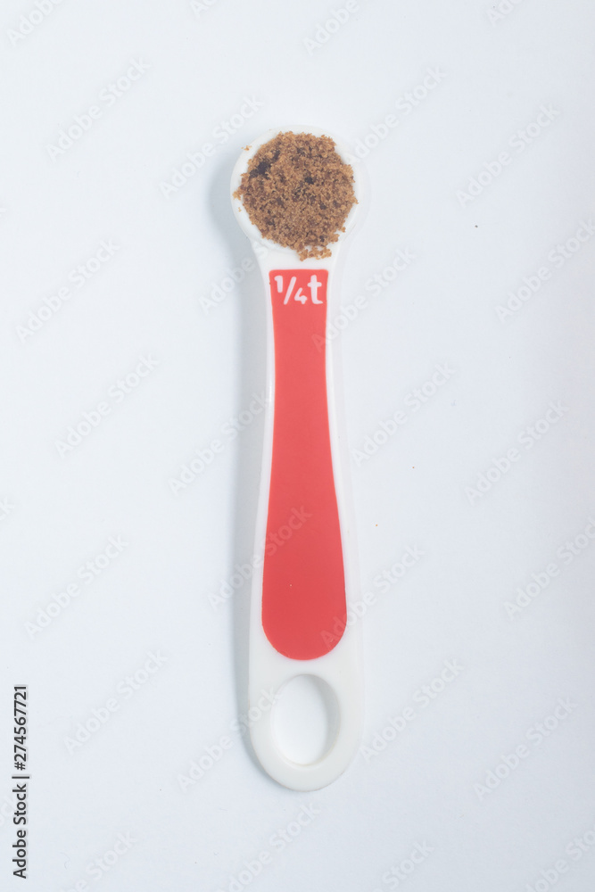 Measuring Tea spoon with Brown sugar Measuring Tea spoon with Brown sugar