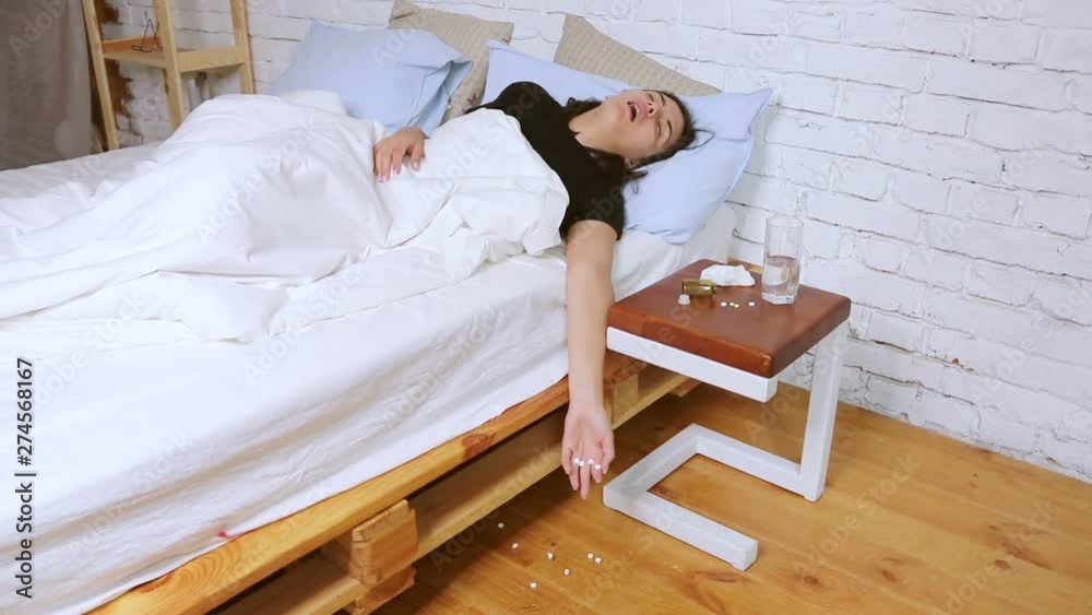 Girl is sick, takes medication lying at home in bed. Girl is sick, takes medication lying at home in bed.
