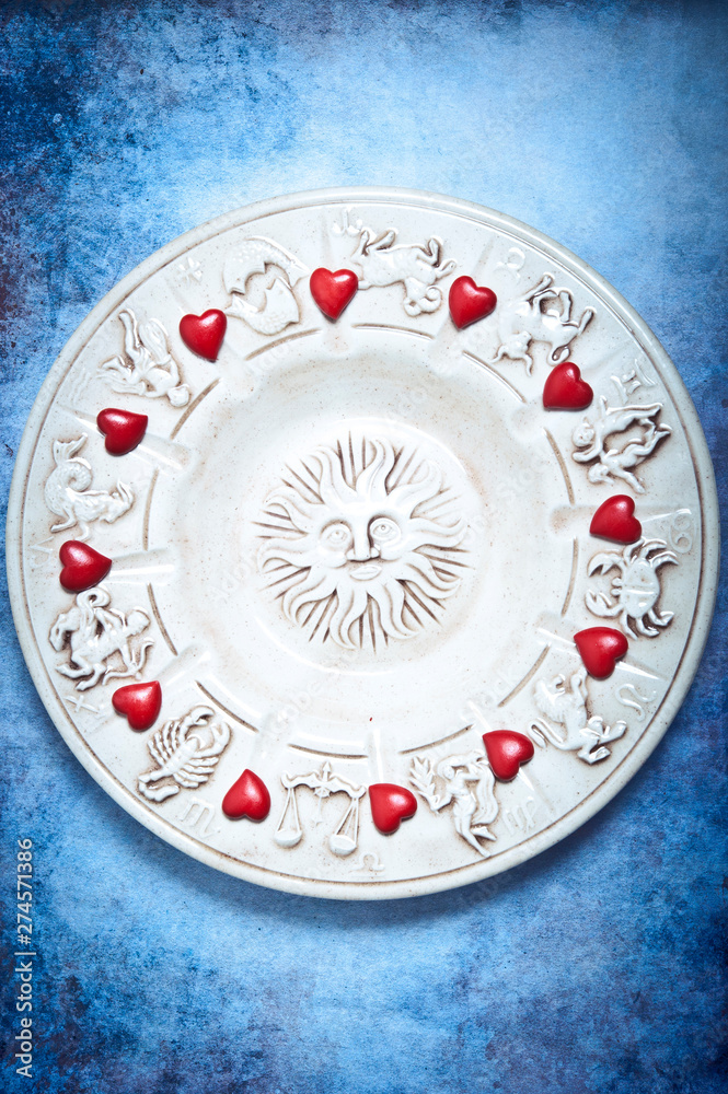 astrology and love concept with zodiac signs, sun and red hearts astrology and love concept with zodiac signs, sun and red hearts