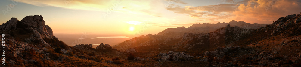 Super wide panorama with mountain range during sunset. Croatia, Europe.