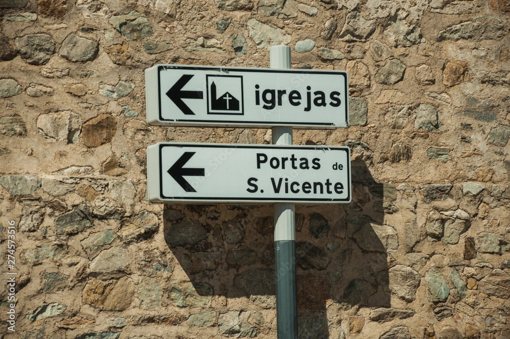Street signpost indicating public services and city attractions Street signpost indicating public services and city attractions