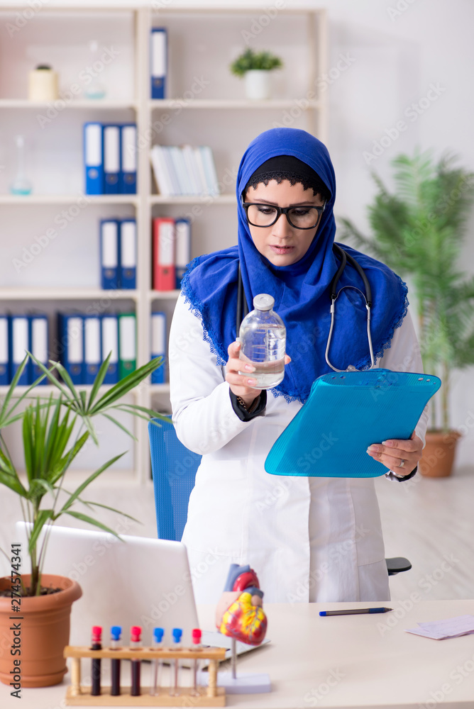 Female doctor in hijab working in the hospital Female doctor in hijab working in the hospital