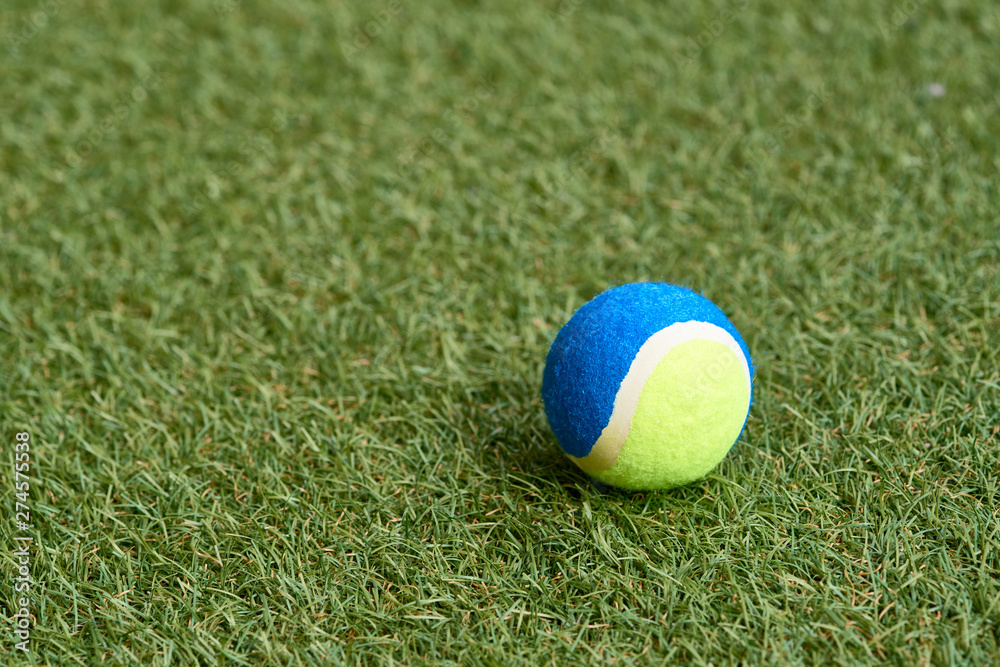 tennis ball on artificial grass
