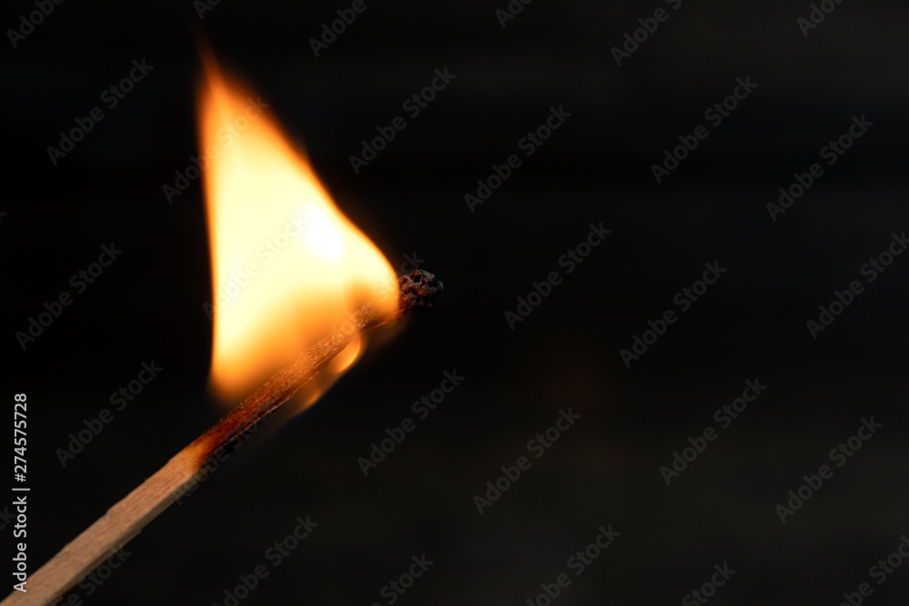 burning match with red, orange ,yello fire isolated on black background burning match with red, orange ,yello fire isolated on black background