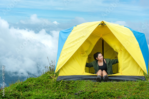 Happy traveler lifestyle women on vacation camping on forest mountain, Thailand. Travel holiday Concept
