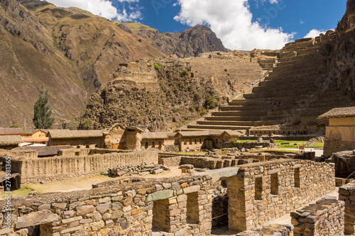 View of Pumatallis terraces, in the Ollantaytambo archaeological site, and part of the Inca town. Amazing ancient city ruins with ceremonial purposes. Travel destination in the Sacred Valley, Peru photo