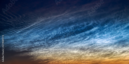  Noctilucent clouds, June 21, 2019, Rhineland Germany, night shining ice clouds glow in a dark sky after sunset, the highest clouds in the Earth’s mesosphere, a beautiful atmospheric phenomenon photo