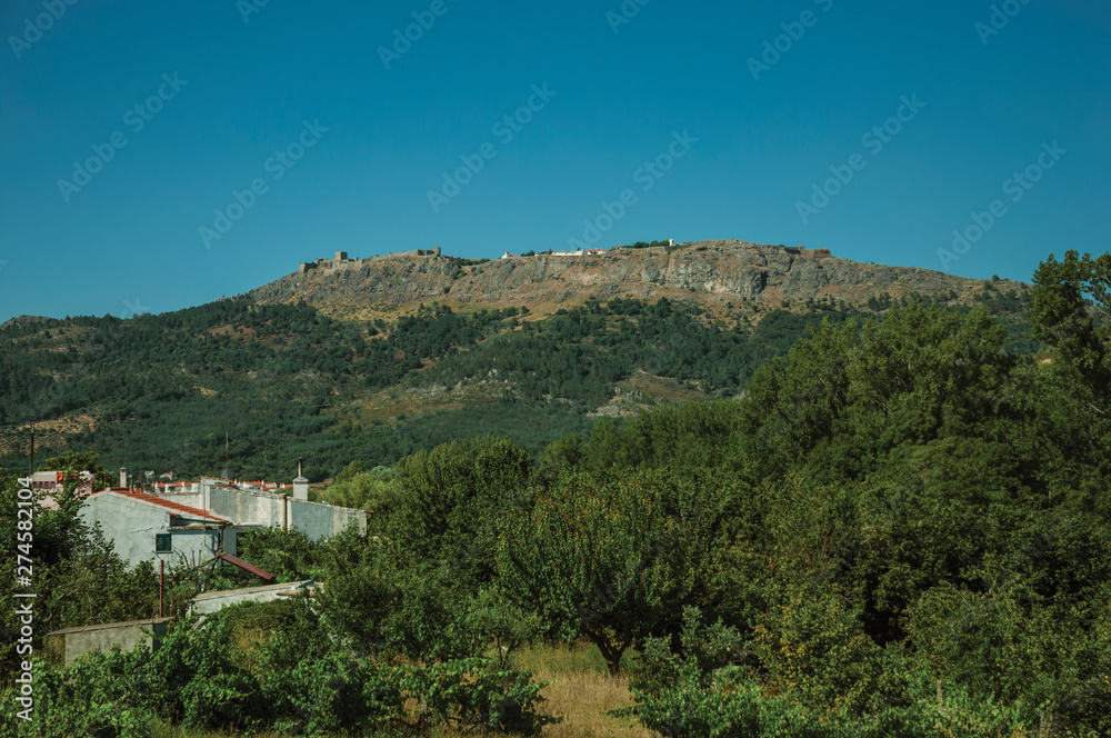 Marvao village on top of crag with stone walls and towers