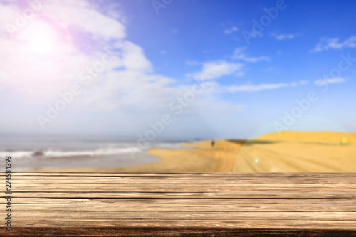 Desk of free space and summer background of beach 