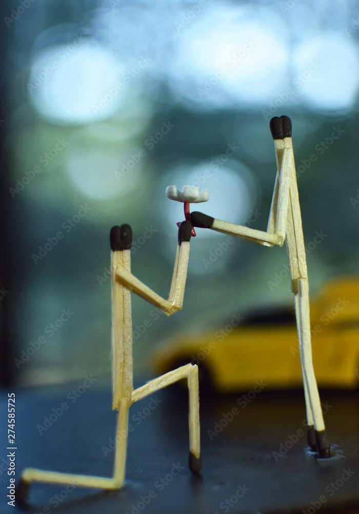 Creative Photography of boy propose to girl with flower using Matches Stick