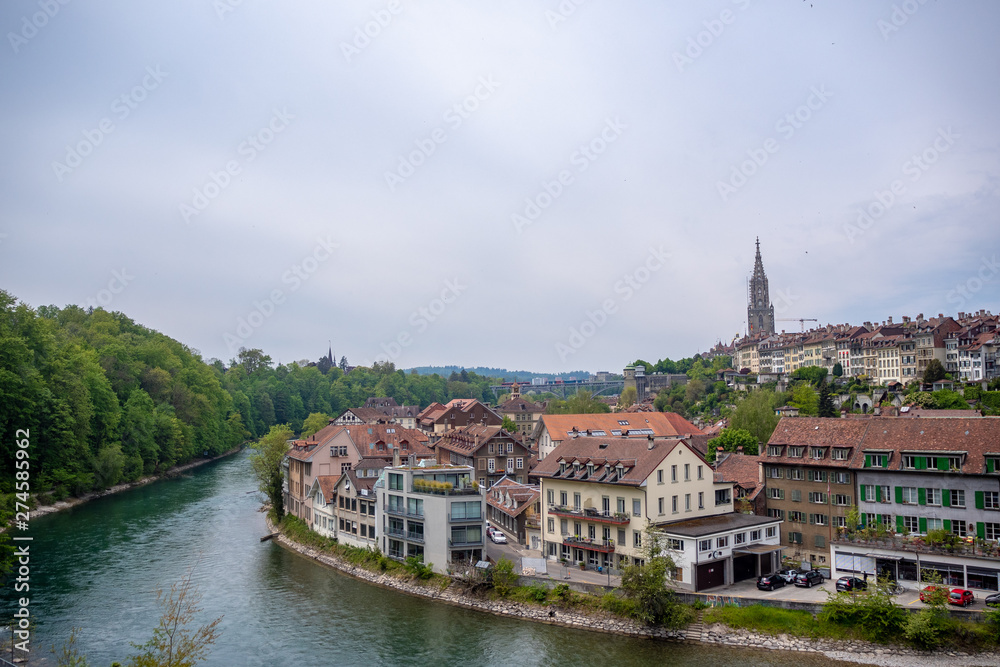 Beautiful panorama view of aare river and  downtown in bern on cloudy sky background