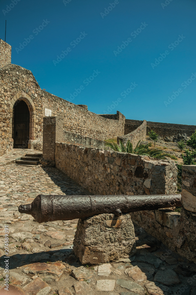 Old iron cannon in the stone outer wall at the Marvao Castle