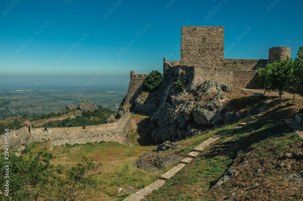 Walls and towers over rocky hill with garden at the Marvao Castle