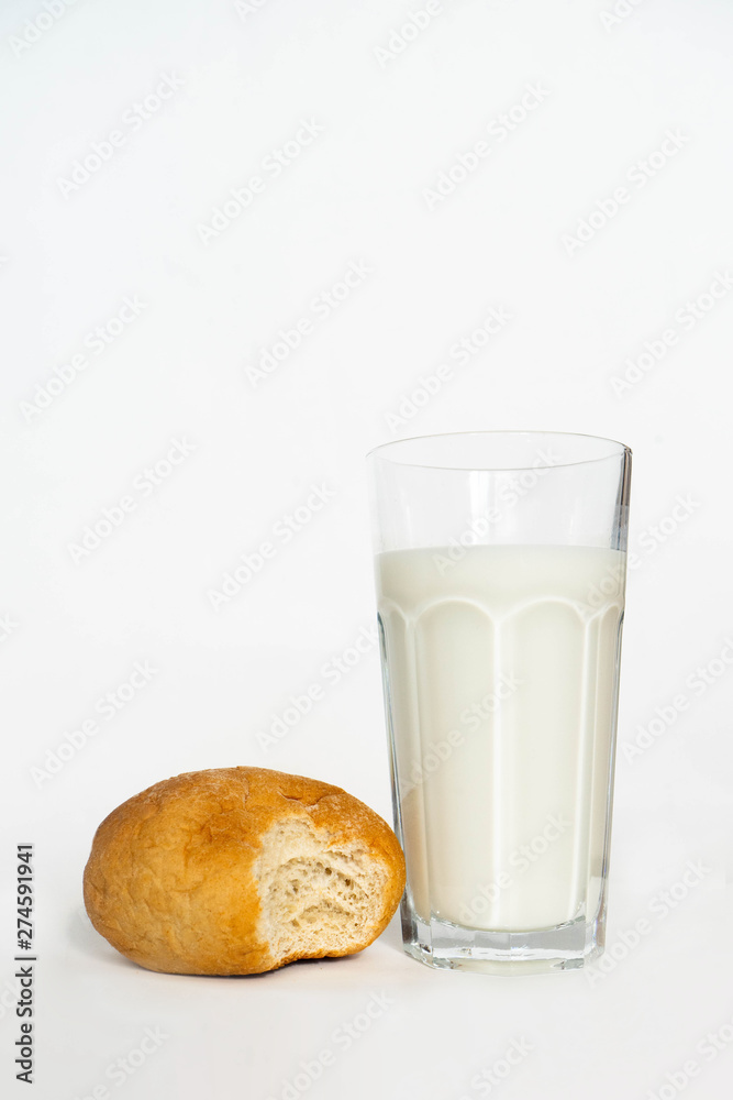 glass of milk and bread isolated on white background glass of milk and bread isolated on white background
