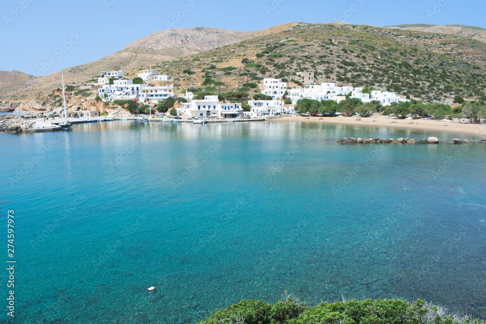 Greece, the island of Sikinos. The port and town beach on a bright spring day