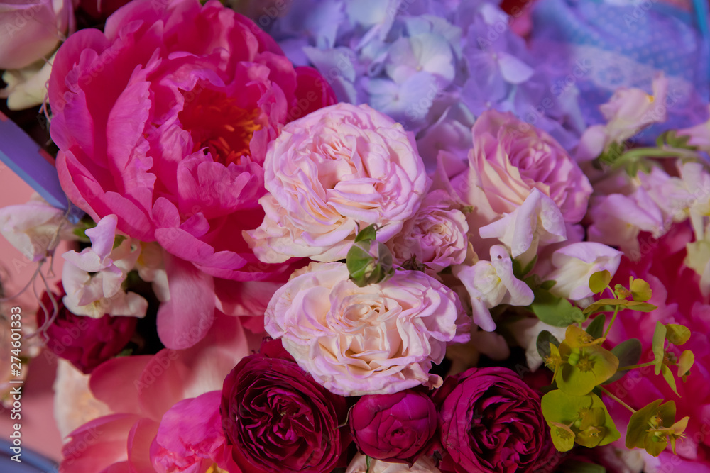 Colorful mixed bouquet with various spring flowers in floral decor, Colorful wedding flowers background . Mixed flower arrangement: various flowers in different shades of red, pink, yellow and orange. Colorful mixed bouquet with various spring flowers in floral decor, Colorful wedding flowers background . Mixed flower arrangement: various flowers in different shades of red, pink, yellow and orange.