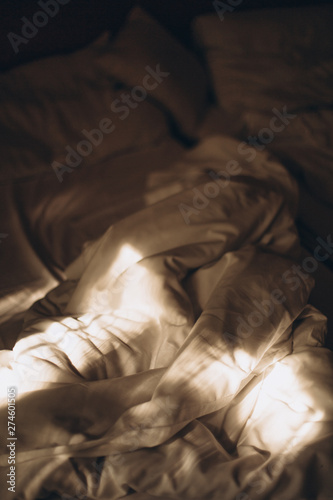 bed textile texture morning sun rays bedroom