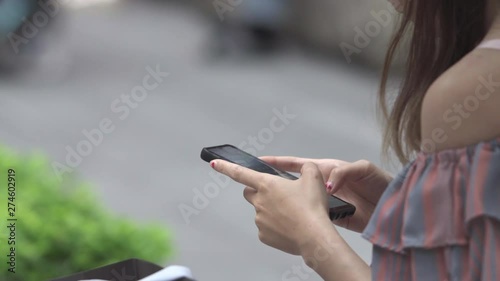 Asian Business Woman  using smart phone at outdoor