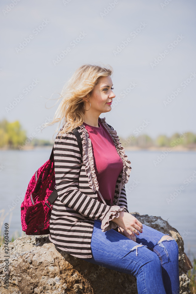 Pretty modern plus size lady lifestyle, woman’s beauty. Female model with large size of figure posing outdoor