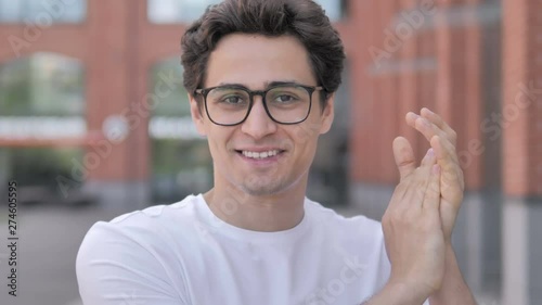 Applauding Young Man, Clapping for Appriciation photo