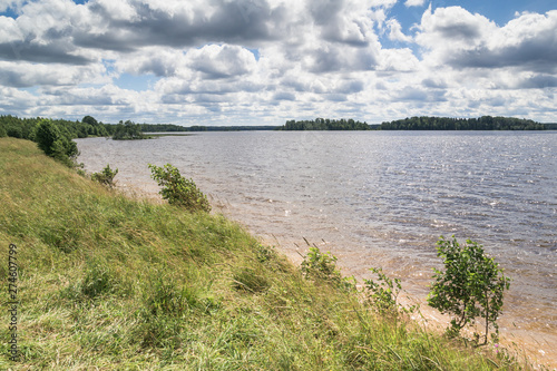 Wallpaper Mural Sunny day on a calm lake in summer, with clouds on the sky Torontodigital.ca