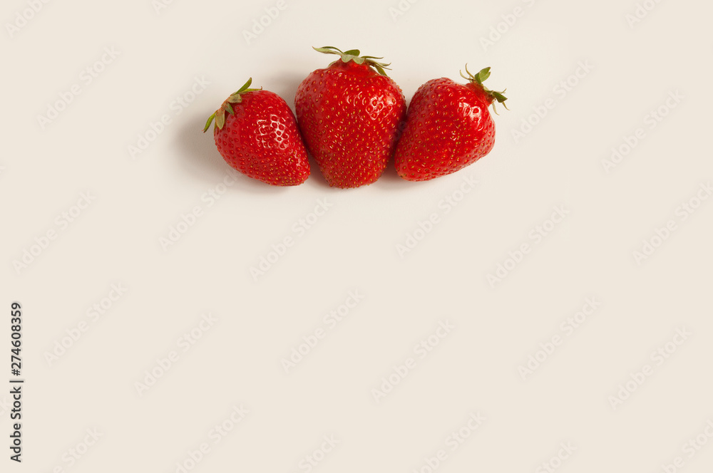 Three fresh red strawberries on white background Three fresh red strawberries on white background