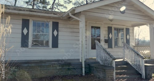 Single family bungalow house - tilt up establishing shot with sun glare photo