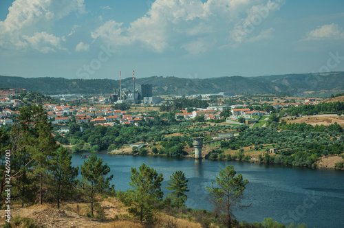 Valley with the wide Tejo River and industry on horizon