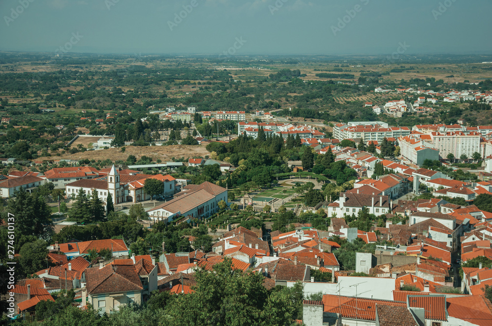 City landscape with old building roofs and church steeple