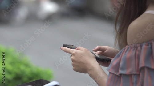 Asian Business Woman  using smart phone at outdoor
