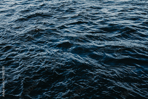 Waving dark blue sea close up