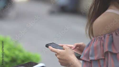 Asian Business Woman  using smart phone at outdoor