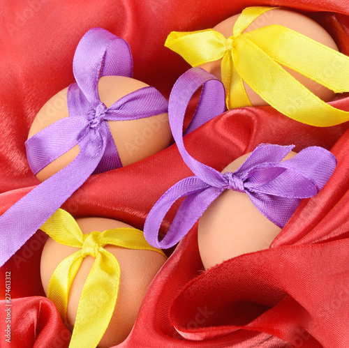 Easter eggs on a red satin fabric.