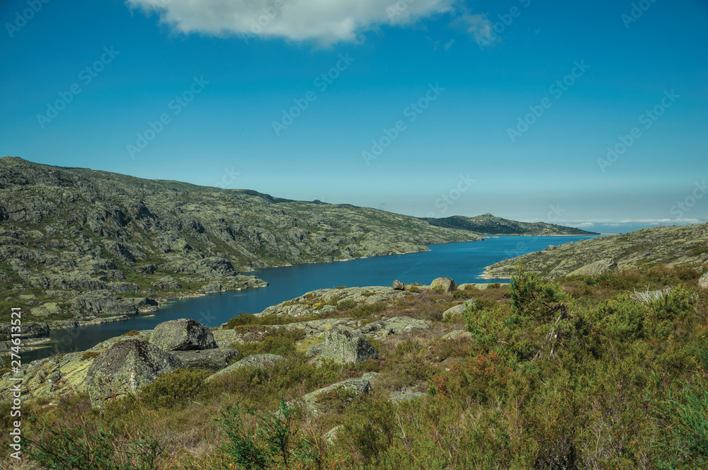 Hilly landscape with lake on highlands Hilly landscape with lake on highlands