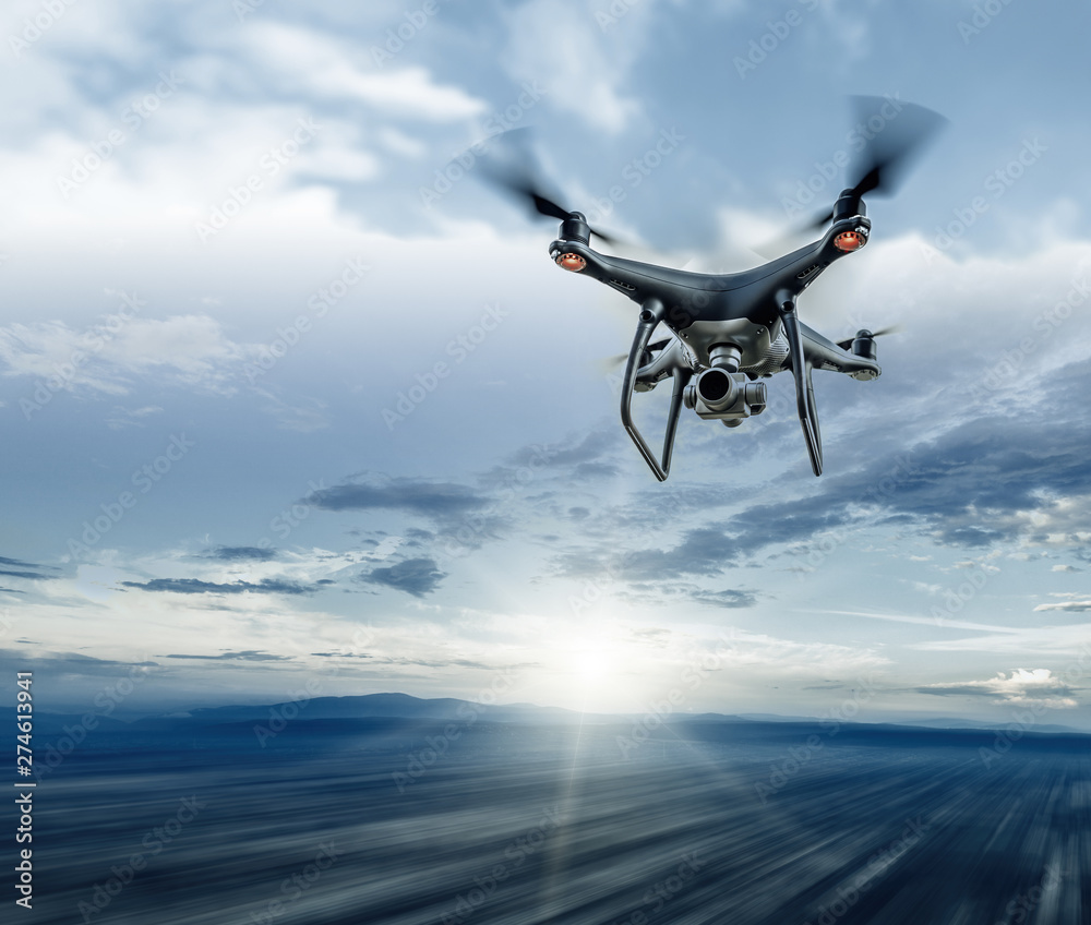 Dark drone in flight over the city.