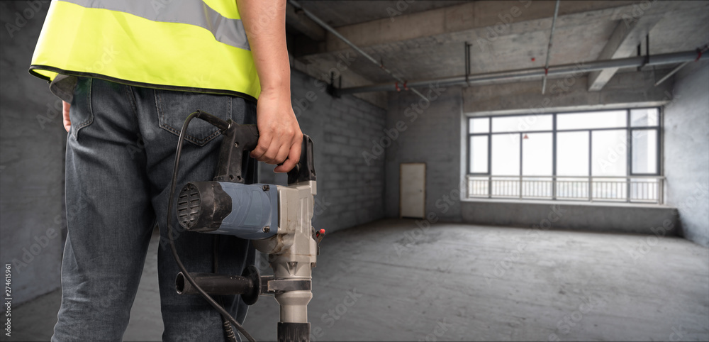 Construction Worker in front of construction site Construction Worker in front of construction site