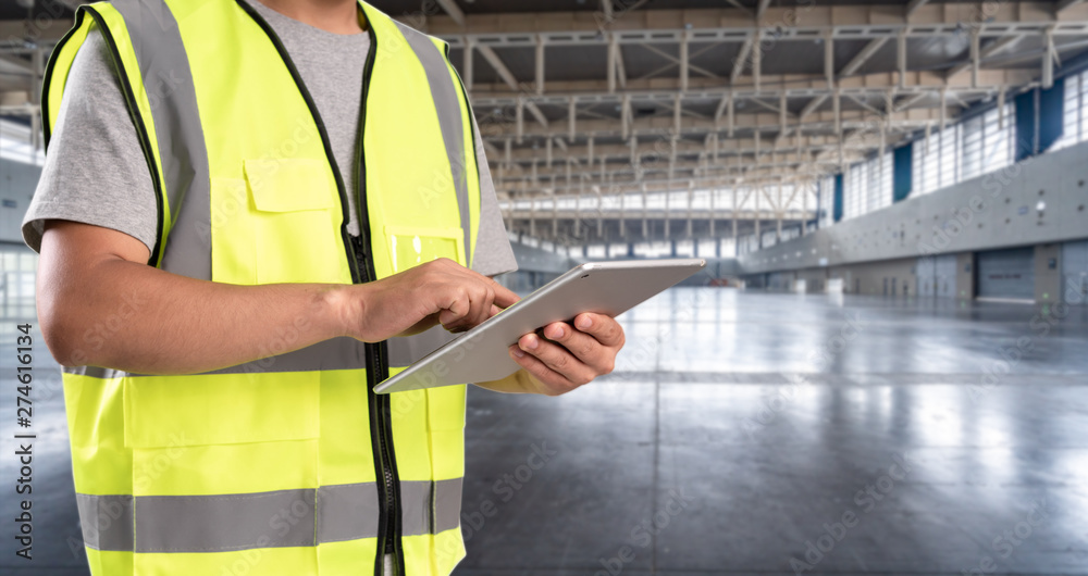 worker hand holding pad for check order pick time in empty warehouse worker hand holding pad for check order pick time in empty warehouse