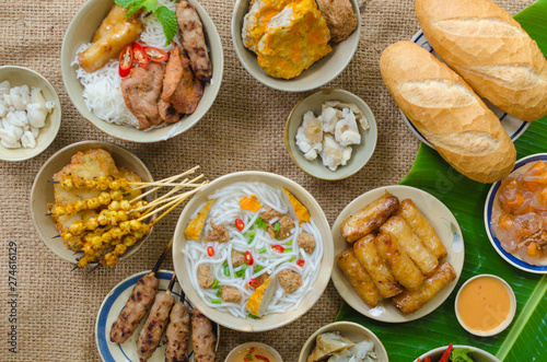 Vietnamese food background with spring roll, banh mi, banh canh, steamed fish ball, shrimp dumpling. Typical cuisine of south central of Vietnam like Binh Thuan, Ninh Thuan, Nha Trang province photo