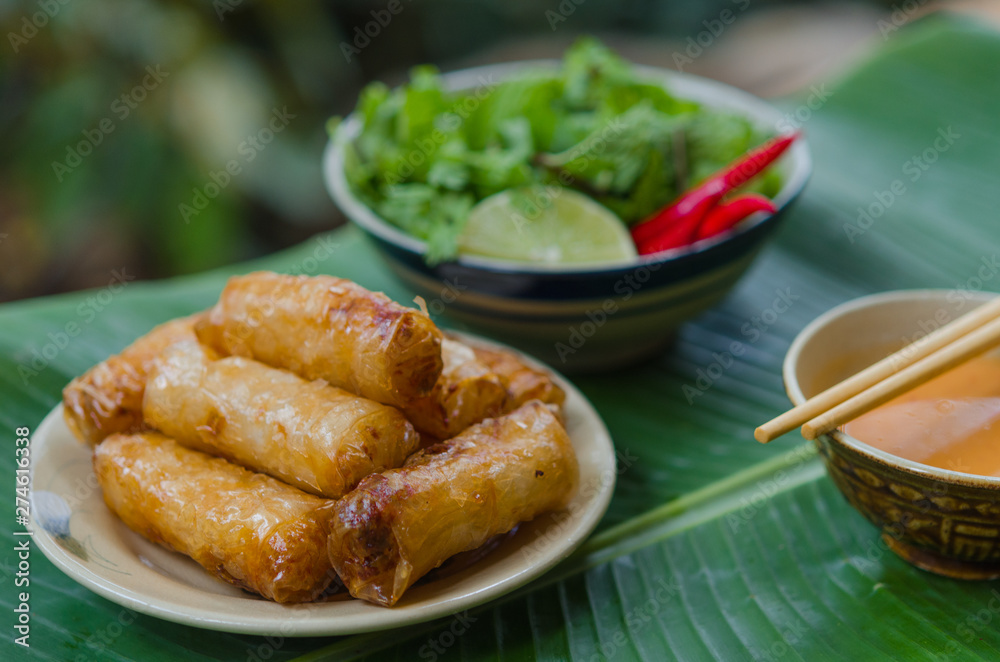 Vietnamese fried spring rolls with fresh vegetable and peanut sauce Vietnamese fried spring rolls with fresh vegetable and peanut sauce